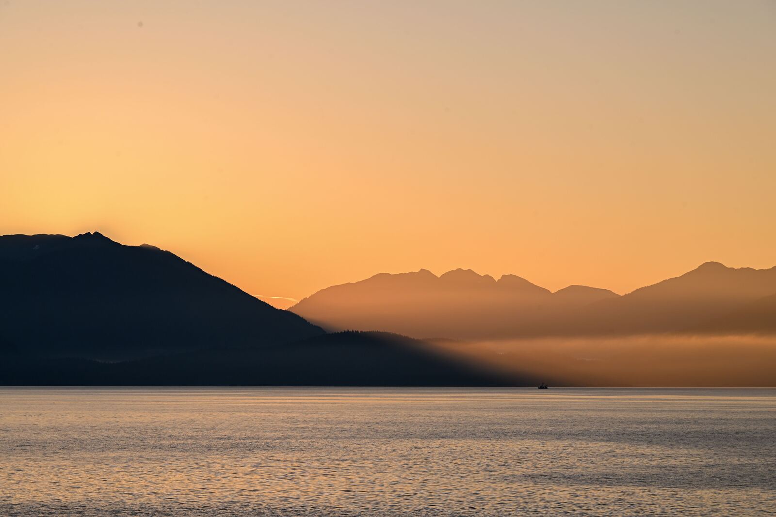 Alaska coastline and mountains at dawn along the Inside Passage