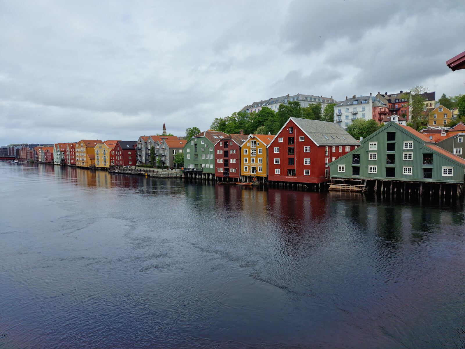 Colorful historic warehouses along the Nidelva river in Trondheim