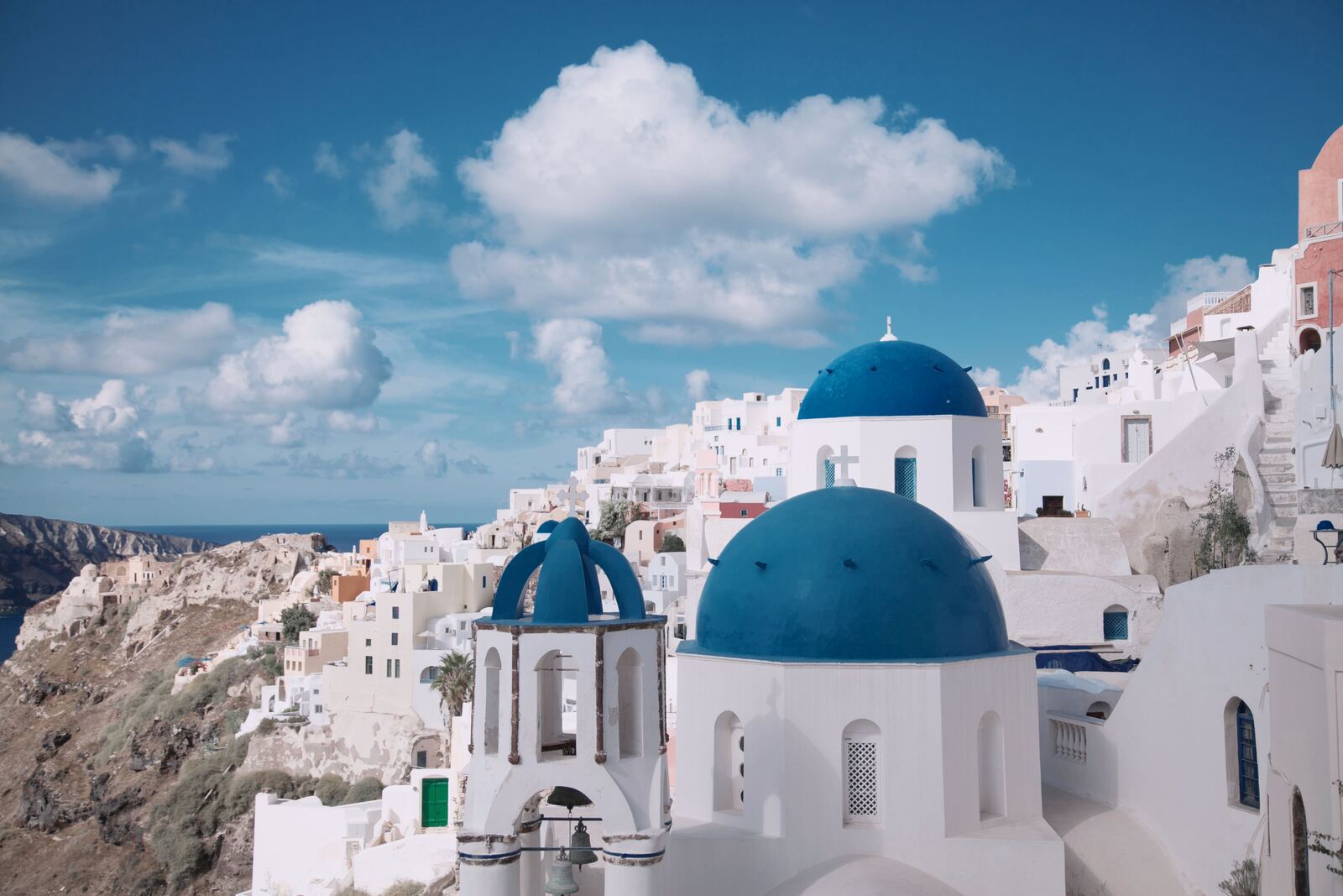 Whitewashed buildings and blue-domed churches on the Santorini caldera